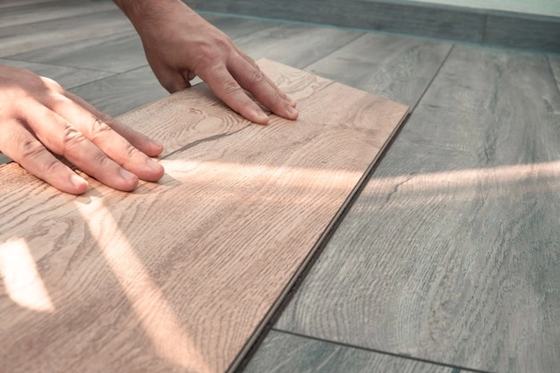 person holding tile plank 2 hands -tile flooring