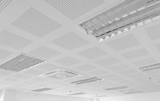 white metal ceiling with holes and lights -ceiling tiles