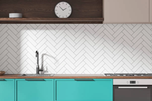 modern kitchen with patterned backsplash, sink with blue bottom cabinet and block on top -backsplash tile